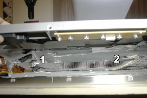 The backside of Medion 30919 PO lifted to see which cables need to be disconnected