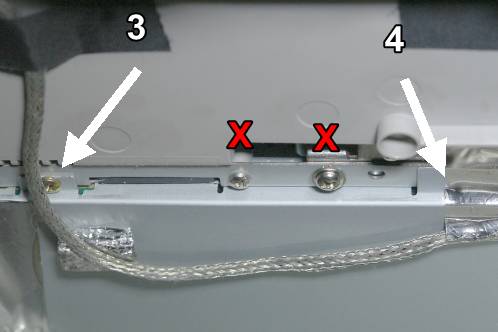 A close-up of the screws that hold the power supply inside the Medion 30919 PO TFT monitor