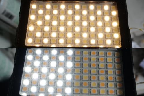 Een zwart kastje met doorzichtig venster met 48 warmwitte LEDs branden en slechts 24 koudwitte LEDs brandend, de overige 24 in een Tristar 4 ledlamp werken niet