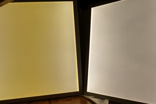 Two Blinq88 PE6060 LED-panels in lighted condition, with one old, yellow-discoloured lightguide and one with new plate